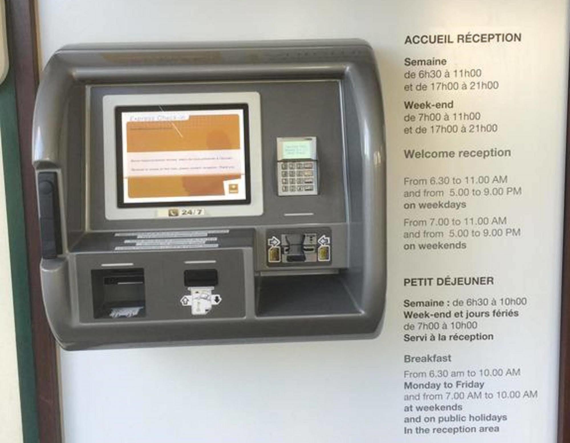 Premiere Classe Évreux Kültér fotó A self-service kiosk at the reception area of a hotel